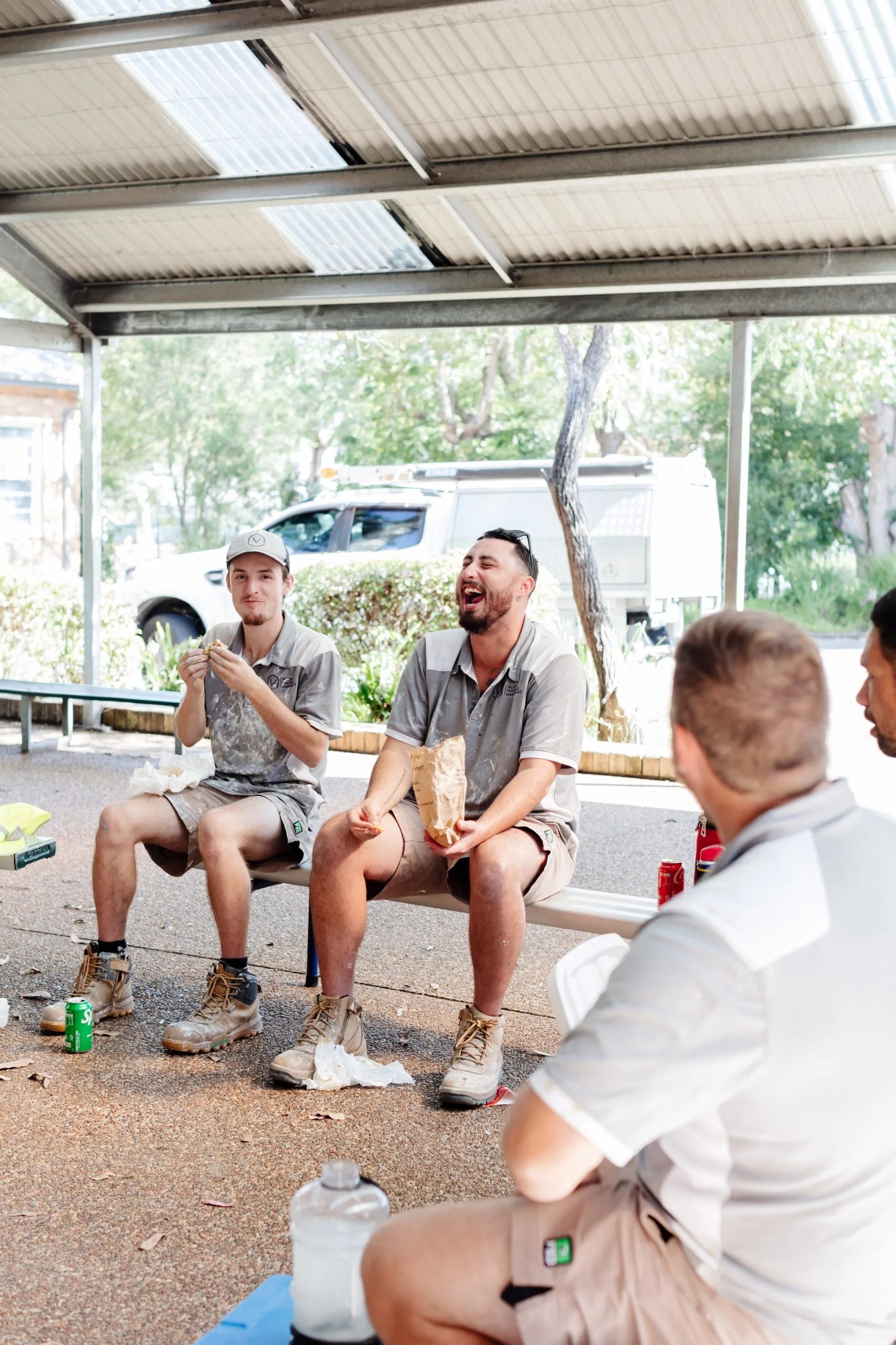 A group of people sitting on a bench.